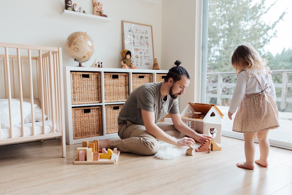 Photo Of Man Playing With Child